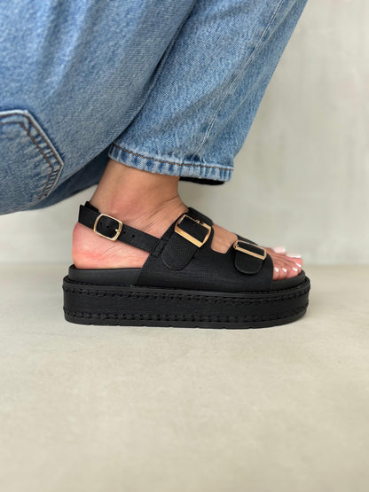 14347 – Sandalias Negras con Plataforma Alta y Hebillas Doradas