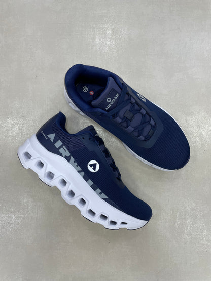 14297 – Tenis deportivos azul marino con suela blanca para hombre