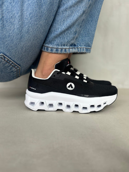 14299 – Tenis Deportivos Negros con Suela Tecnológica y Detalles Blancos